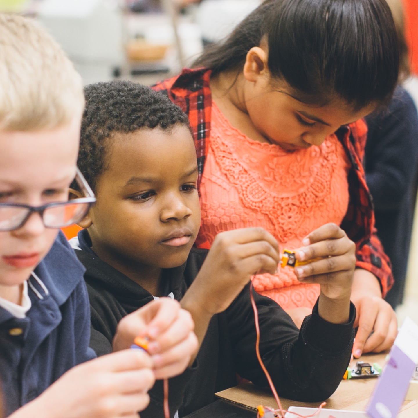 Three students learning about engineering